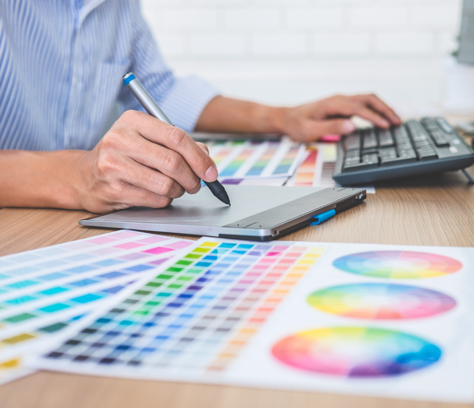 man doing graphic design using a pen tablet