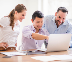 checking their business on social media using a laptop
