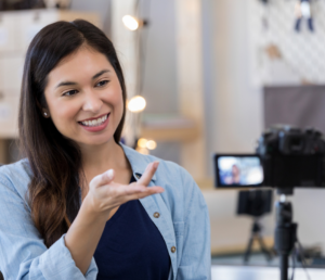a beautiful woman filming an instructional video